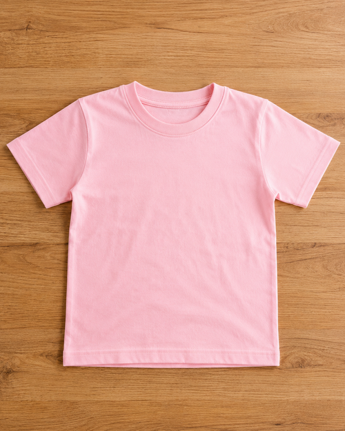 Baby Pink t-shirt with round neck and half sleeve on a wooden background table 