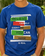 Boy wearing a Believe Yourself Dark Blue Kid's T-shirt  close view
