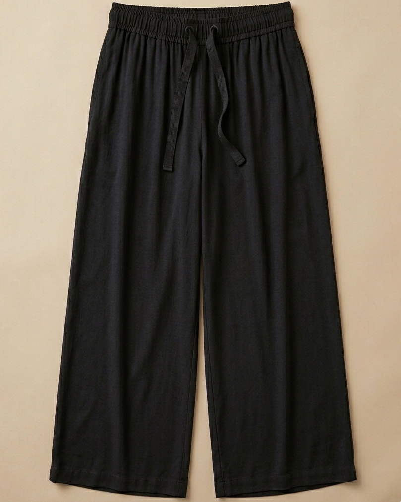 Black Palazzo Pant placed on beige colour background
