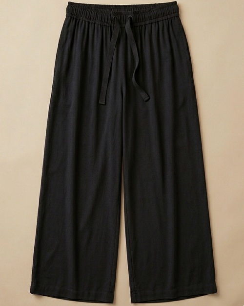 Black Palazzo Pant placed on beige colour background