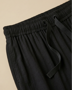 Black Palazzo Pant closeup view placed on beige background