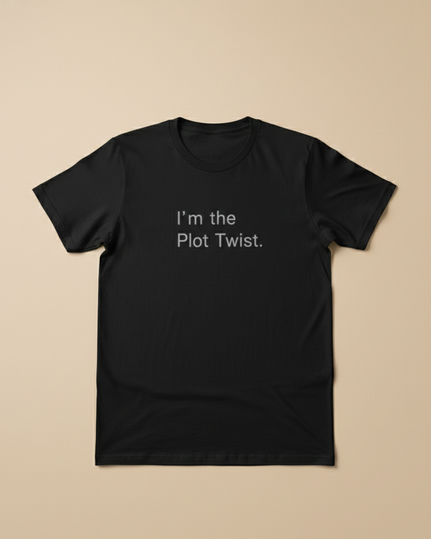 Black t-shirt with 'I'm the Plot Twist' text on a beige background.