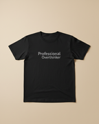 Black t-shirt with 'Professional Overthinker' text on a beige background