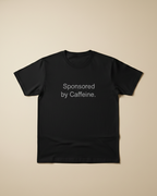 Black t-shirt with 'Sponsored by Caffeine.' text on a beige background