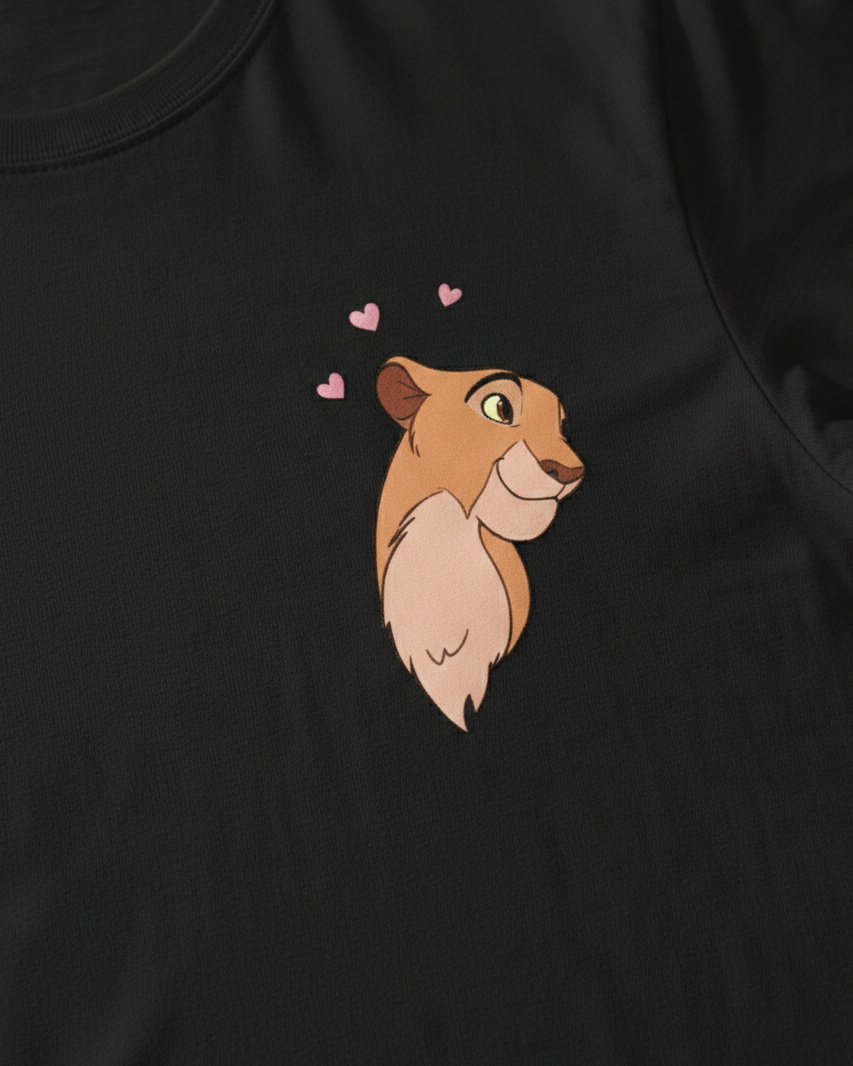 Black t-shirt with a cartoon lion head design and hearts on a dark background