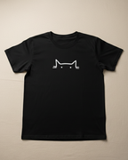 Black t-shirt with a white cat outline design on a beige background