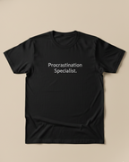 Black t-shirt with text in a plain beige background.