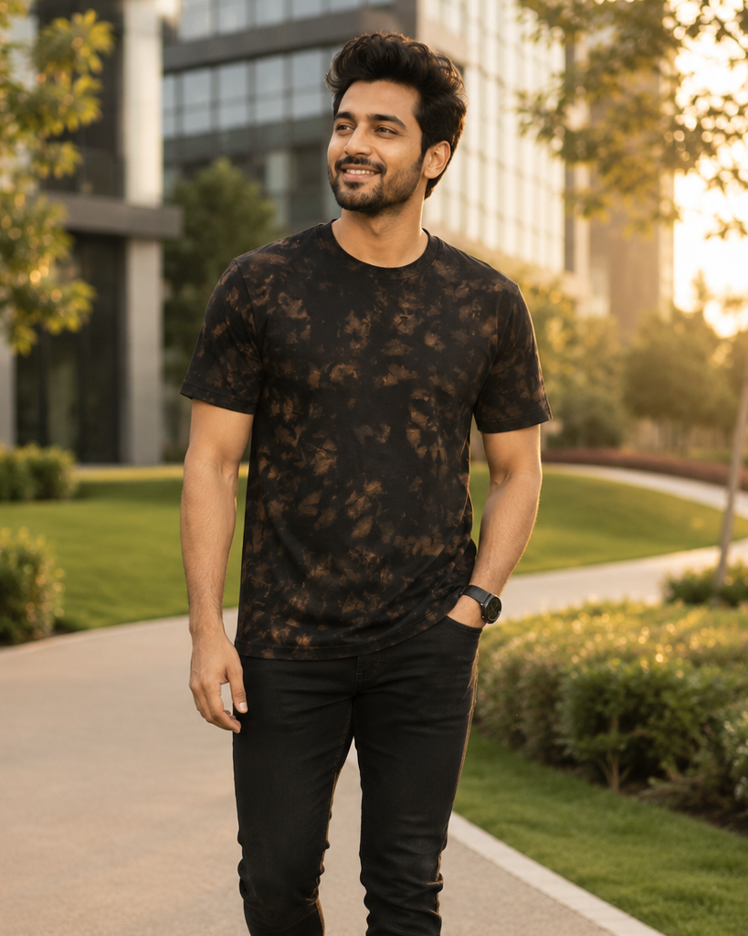 Men wearing Bleached Casual Wear Black Tie Dye Cotton T-Shirts  in the background of  building surrounded with nature .