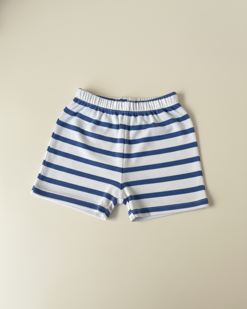 Blue and white striped shorts on a beige background