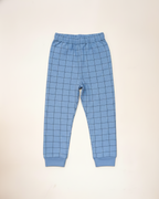 Blue checkered pants on a beige background