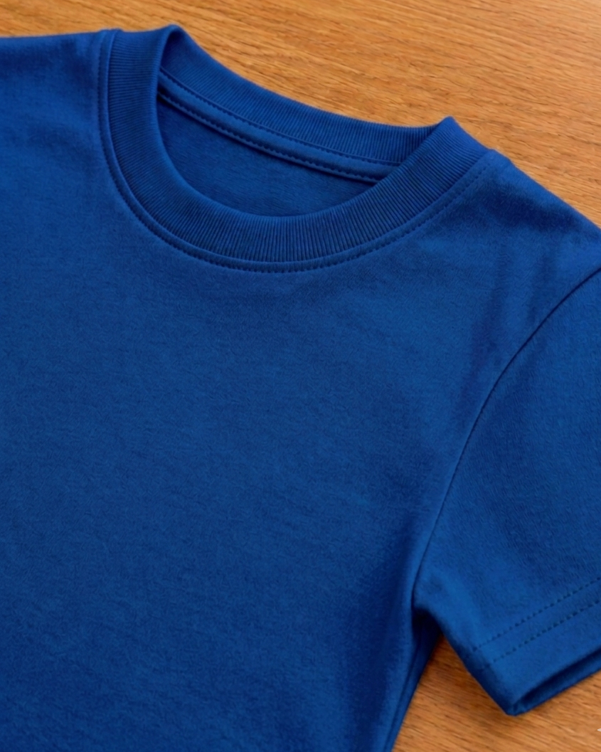 Blue t shirt on a beige background