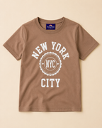Brown T-shirt with NYC print placed on the light beige Background
