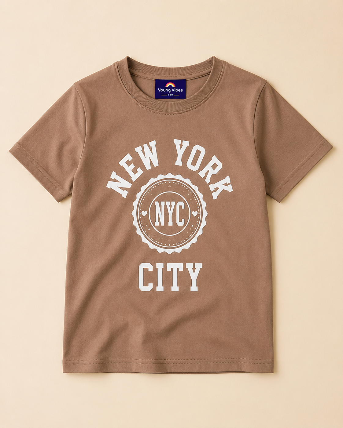 Brown T-shirt with NYC print placed on the light beige Background
