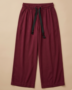 Burgundy Palazzo Pant placed on beige colour background