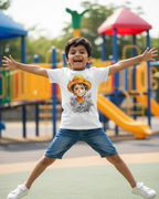 Child jumping on a playground with a colorful slide and equipment in the background