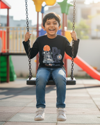Child on a swing at a playground with colorful dream in the background.