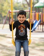 Child on a swing wearing a black t-shirt with a graphic design in a playground setting