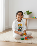Child playing with colorful blocks on a rug in a room with a plant and table.