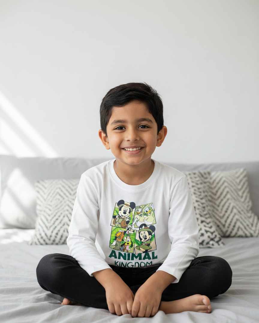 Child wearing a 'Disney Animal Kingdom' shirt in a minimalist bedroom background.