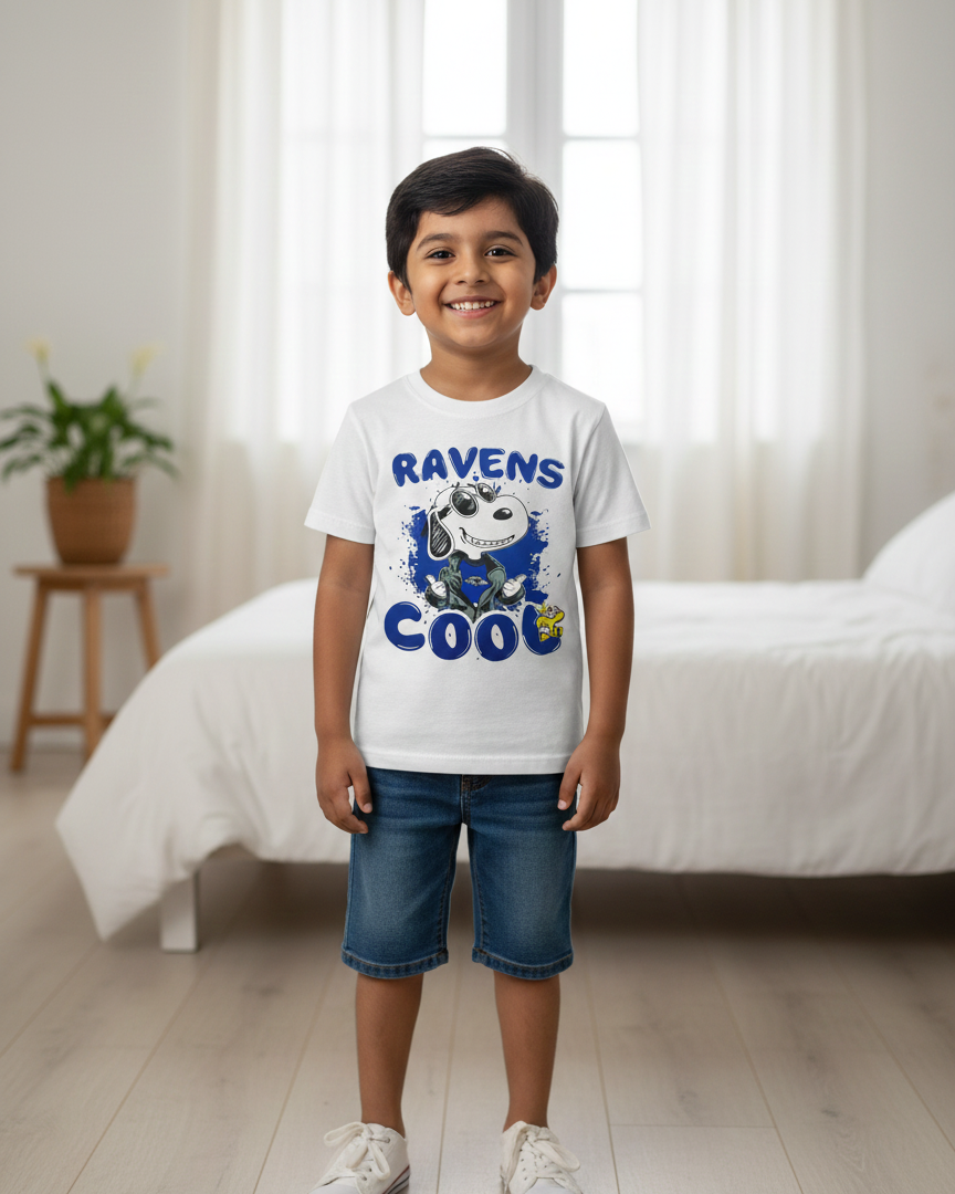 Child wearing a 'Ravens Cool' graphic t-shirt in a bedroom setting