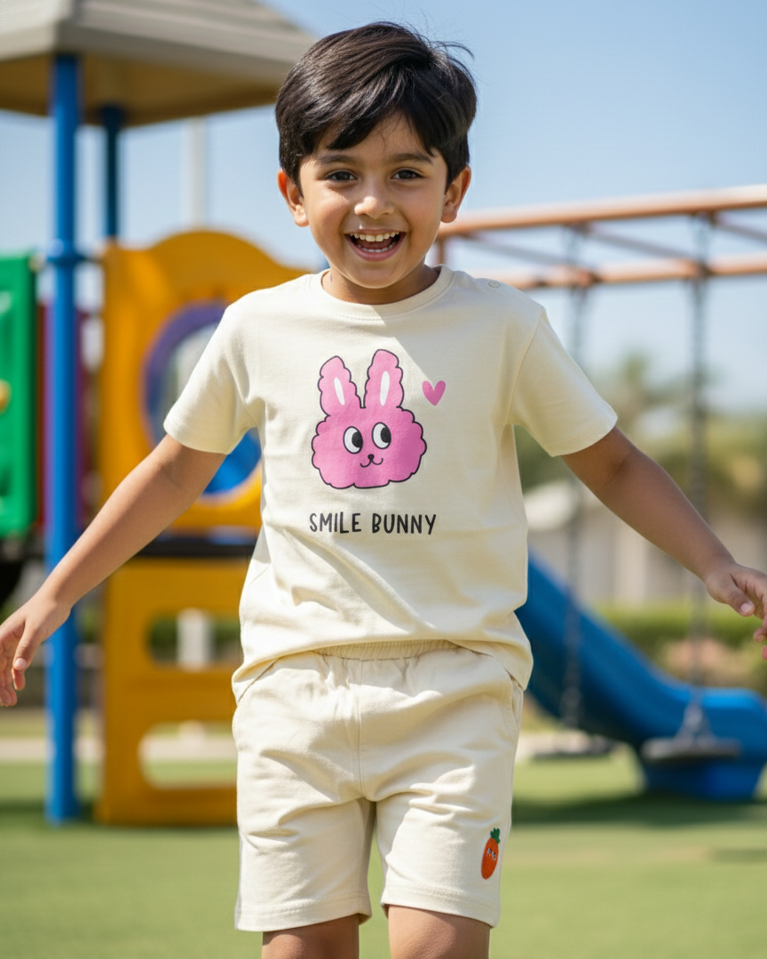 Child wearing a 'Smile Bunny' t-shirt at a playground