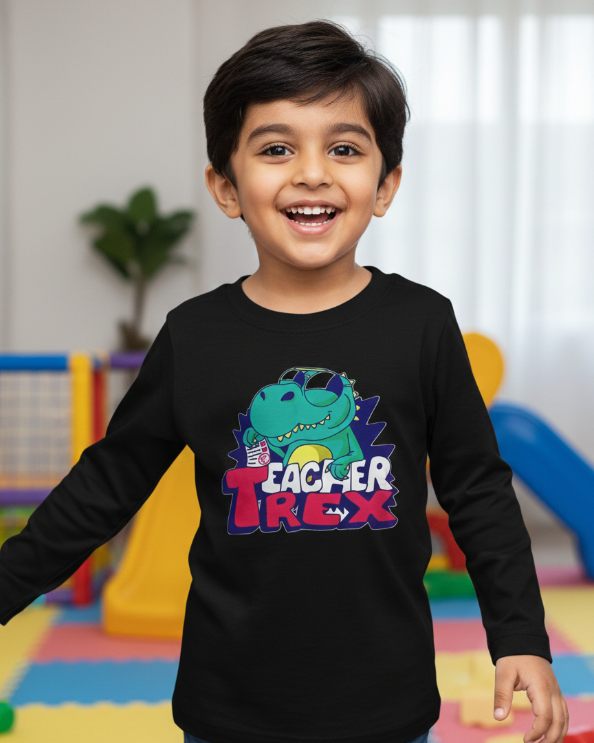 Child wearing a black long-sleeve shirt with a colorful dinosaur graphic and text in an indoor setting.