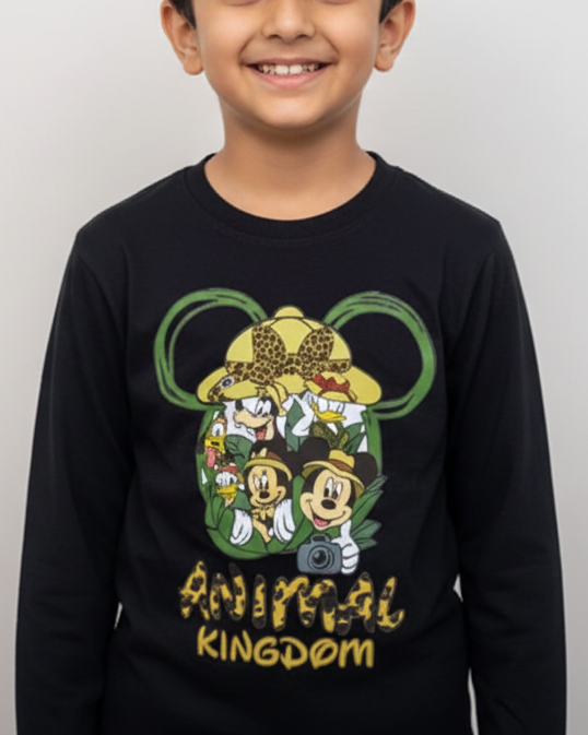 Child wearing a black long-sleeve shirt with a colorful graphic design on a light gray background