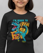 Child wearing a black long-sleeve shirt with a dinosaur graphic and text on a gray background
