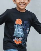 Child wearing a black long-sleeve shirt with a robot and basketball design on a gray background