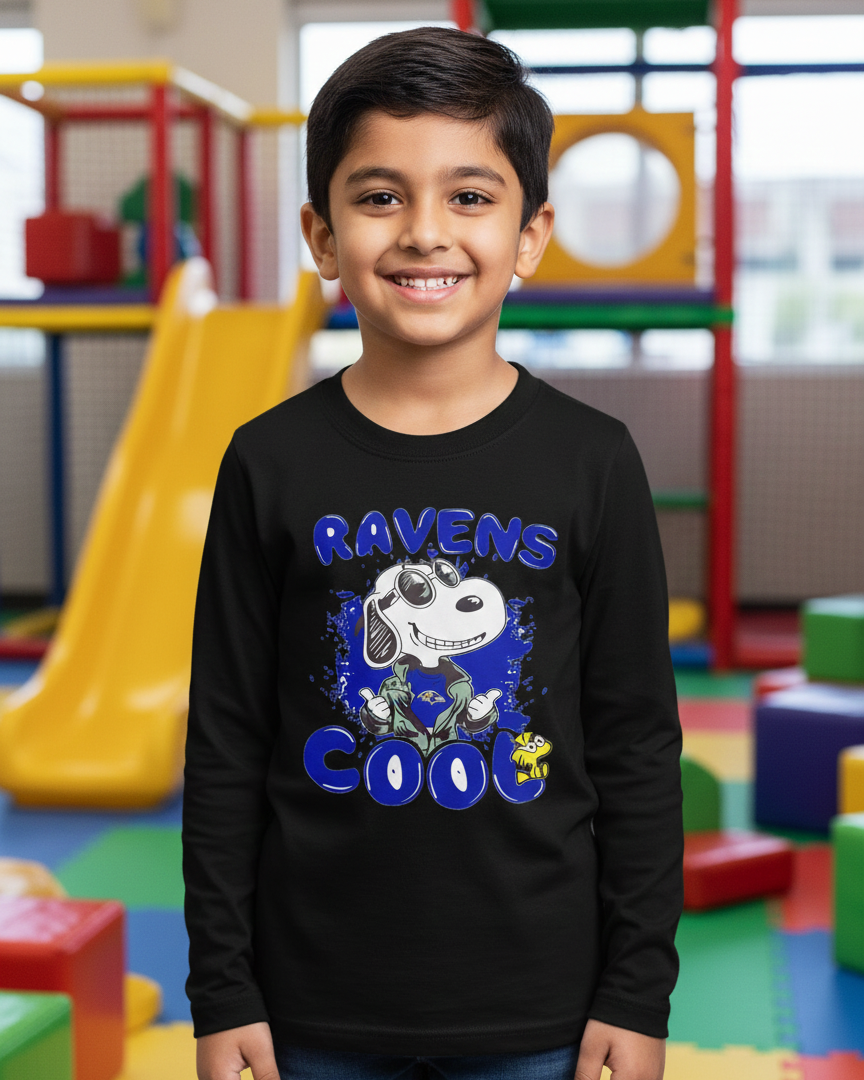Child wearing a black sweatshirt with 'Ravens Cool' design in a colorful playground setting