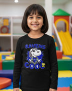 Child wearing a black sweatshirt with a graphic design in a colorful indoor playground.