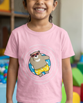 Child wearing a pink t-shirt with a cartoon bear design in a colorful playroom.