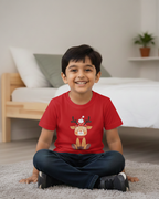 Child wearing a red shirt with a reindeer design, sitting on the floor in a room.