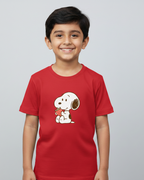 Child wearing a red t-shirt with a cartoon character on a gray background