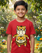Child wearing a red t-shirt with a tiger design in a garden setting