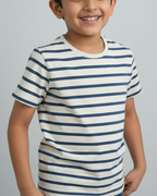 Child wearing a striped shirt against a plain background