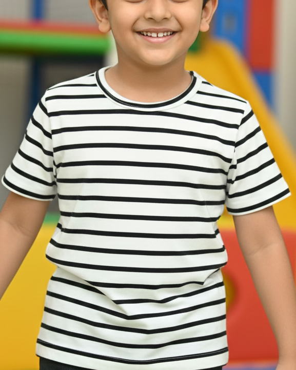 Child wearing a striped shirt in an indoor playground setting