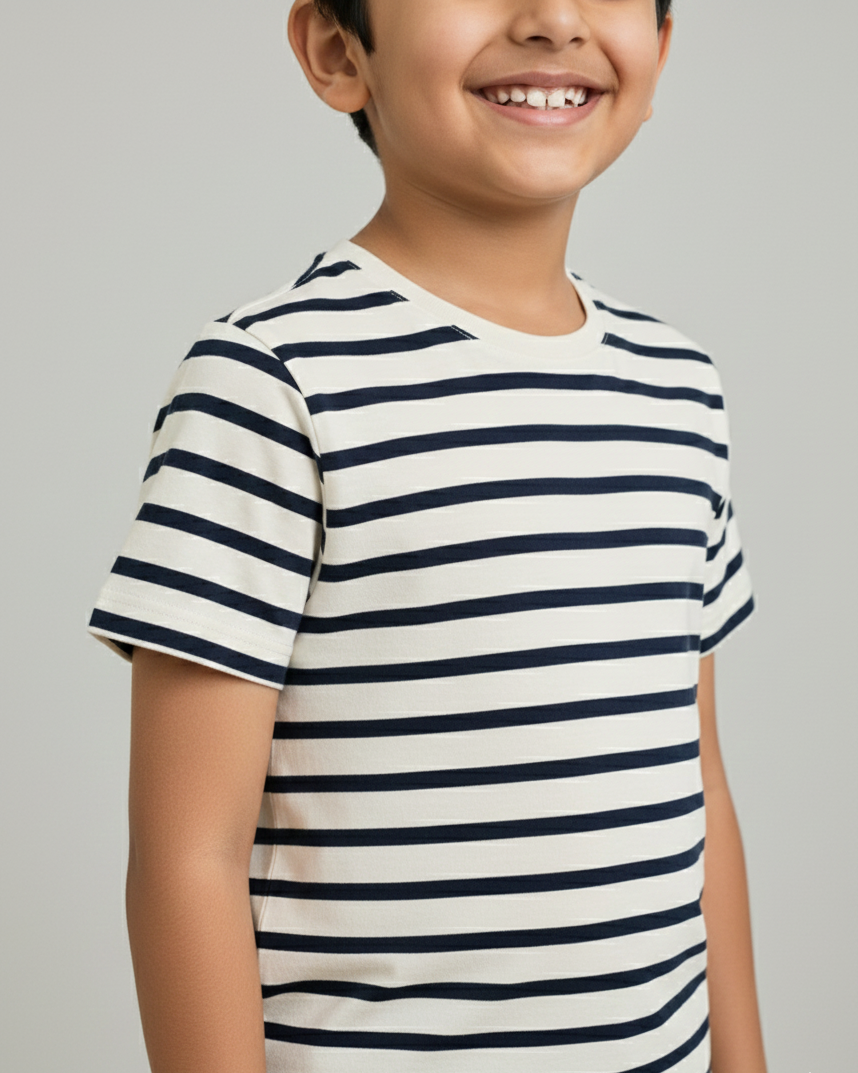 Child wearing a striped t-shirt against a plain background