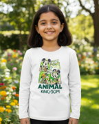Child wearing a white long-sleeve shirt with 'Animal Kingdom' design in a garden setting