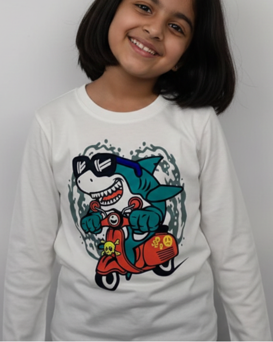 Child wearing a white long-sleeve shirt with a colorful graphic design on a plain background.