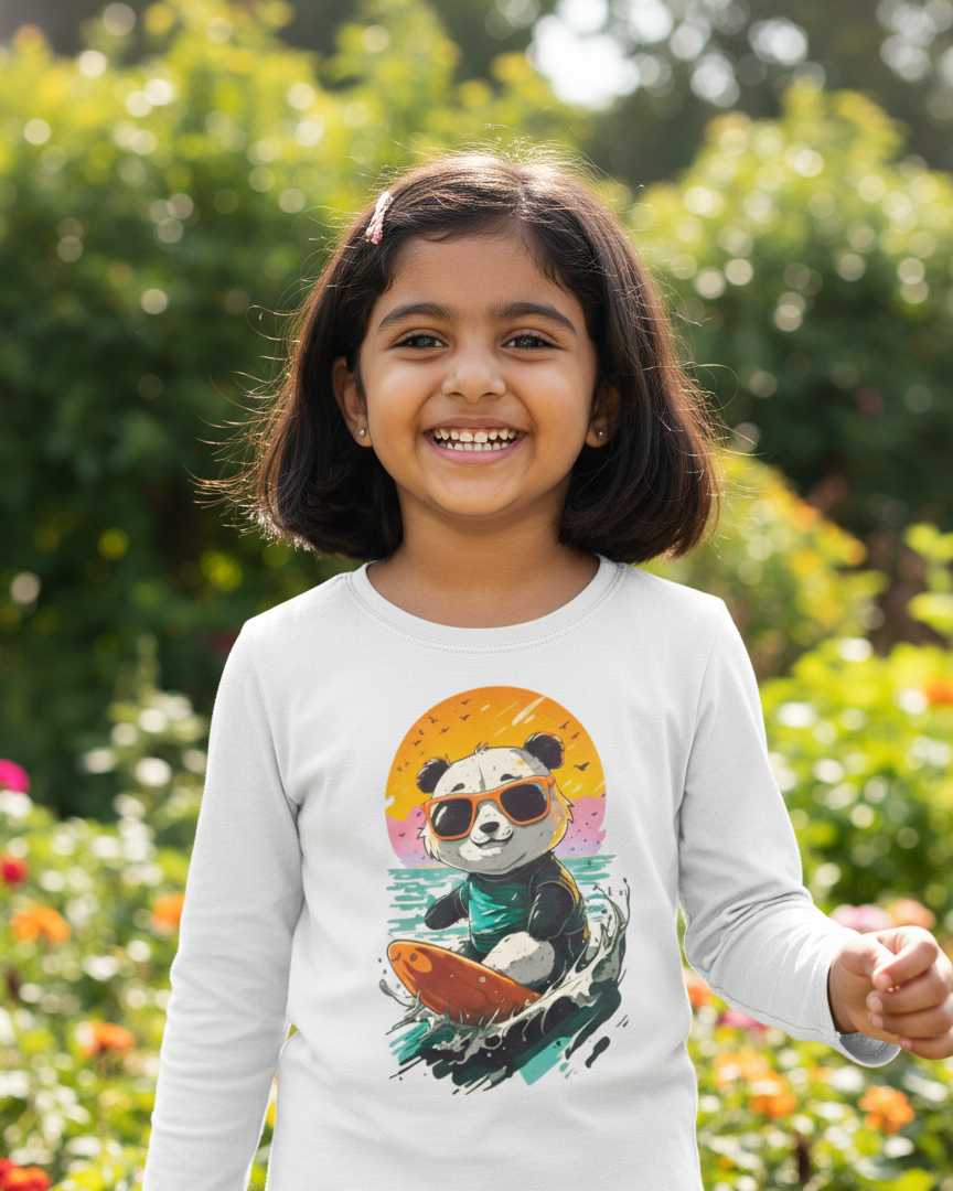 Child wearing a white long-sleeve shirt with a colorful panda design in a garden setting