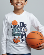 Child wearing a white long-sleeve shirt with a graphic design, holding a basketball against a gray background