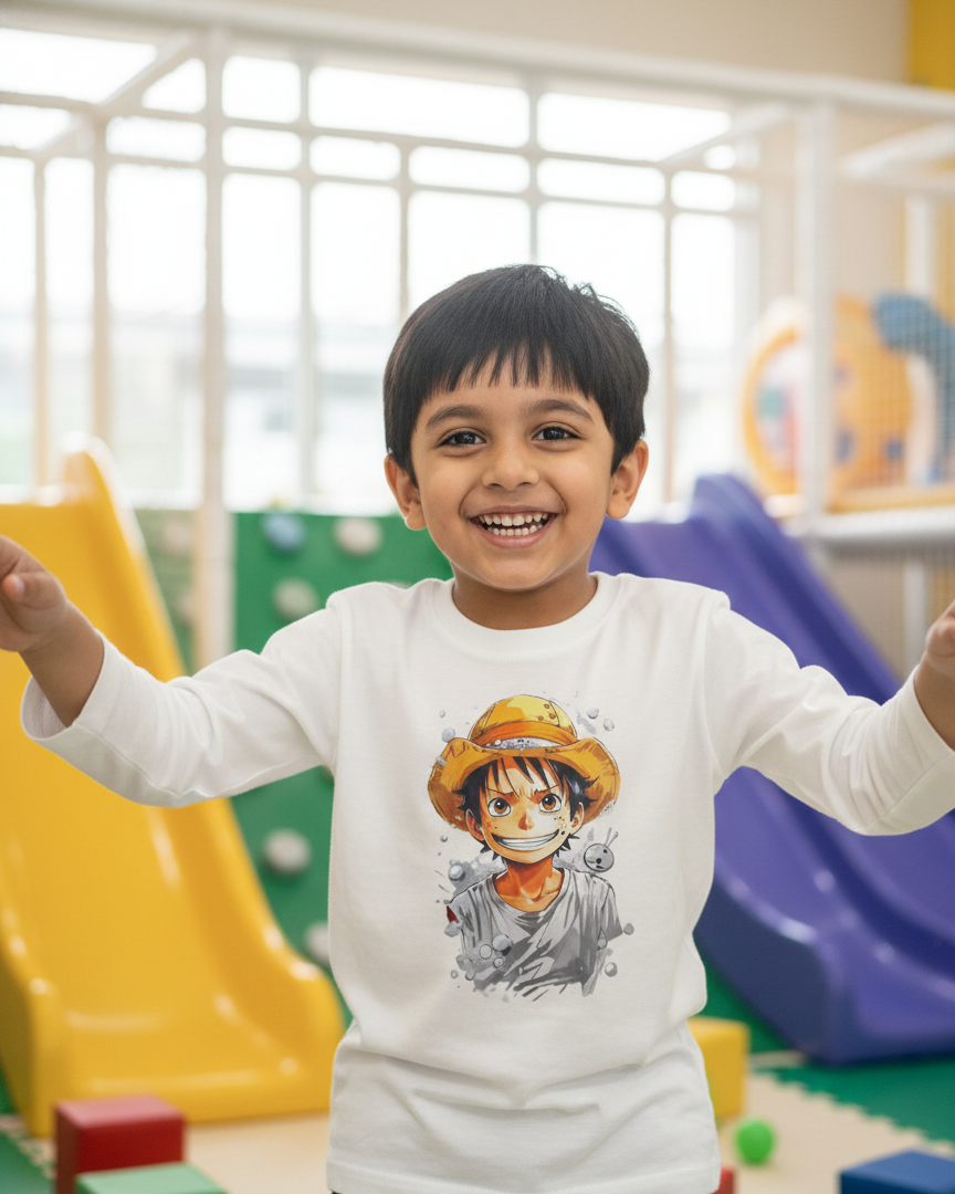 Child wearing a white long-sleeve shirt with a graphic design in a playground setting