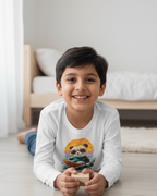 Child wearing a white long-sleeve shirt with a panda design in a minimalist bedroom background.