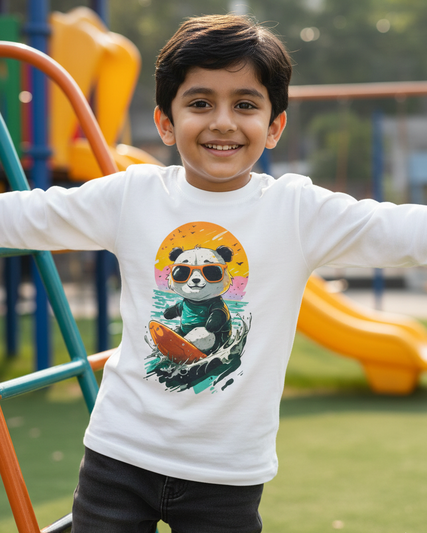 Child wearing a white long-sleeve shirt with a panda design in an outdoor playground.
