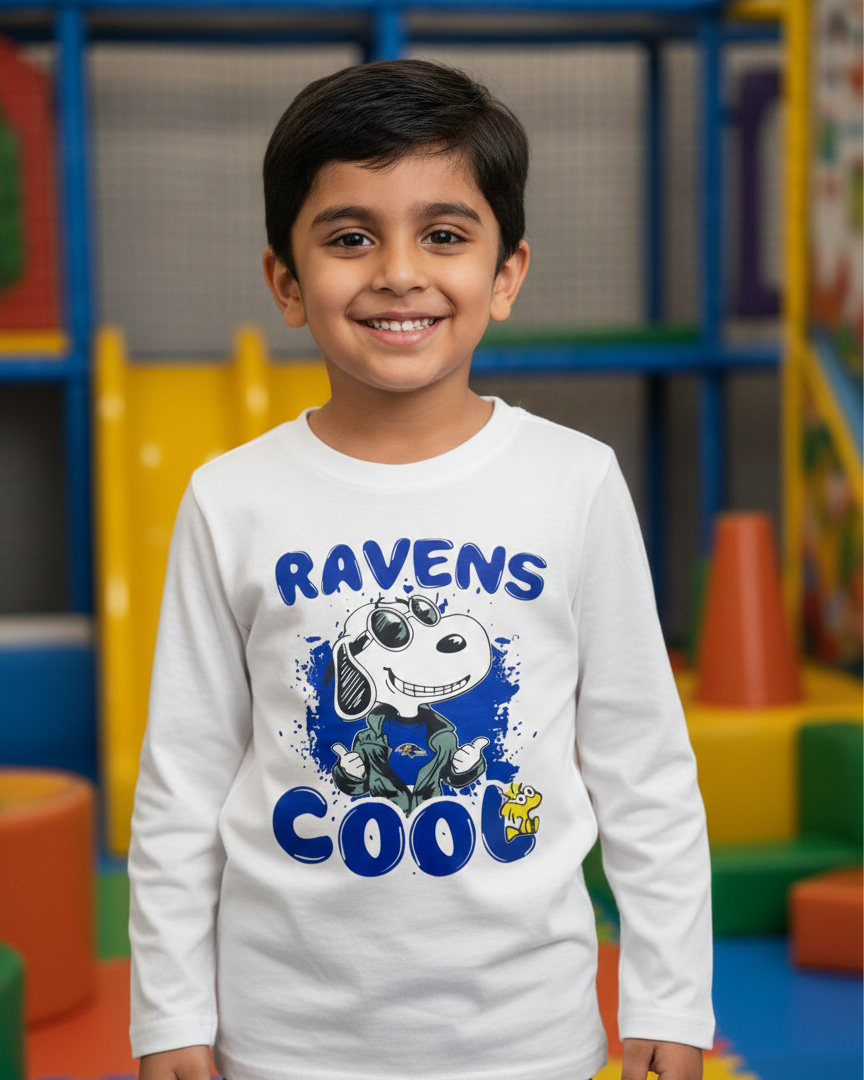 Child wearing a white sweatshirt with 'Ravens Cool' design in a colorful indoor setting