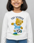 Child wearing a white sweatshirt with a teddy bear graphic and 'Top Scorer' text on a gray background