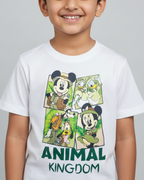 Child wearing a white t-shirt with 'Animal Kingdom' graphic design on a gray background
