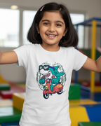 Child wearing a white t-shirt with a colorful graphic design in an indoor playground