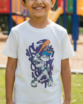 Child wearing a white t-shirt with a colorful graphic design on a playground background